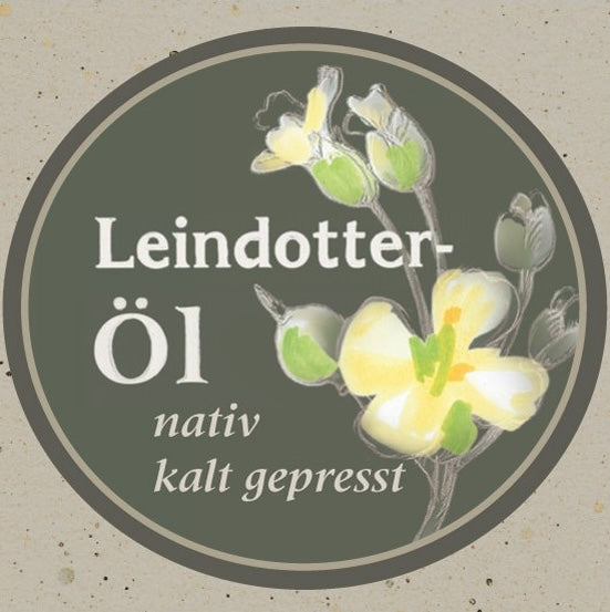 Etikett des Leindotteröls nativ kaltgepresst der Ölmühle Garting mit gezeichneter Leindotterblüte auf creme Hintergrund